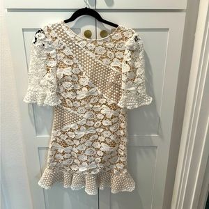 Lulus white mini dress with see through tan color. Beautiful dress.